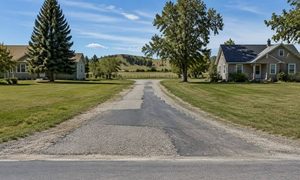 Shared driveway between two homes where a boundary line survey helps before widening or resurfacing